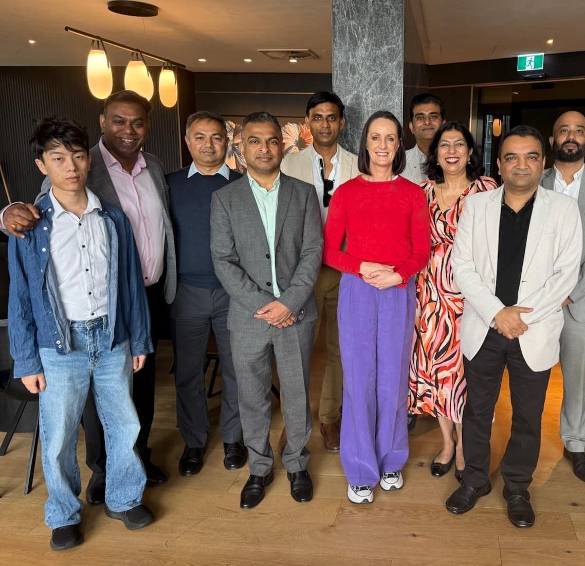 Sarah Witty MP standing with LITA members and local business owners at a business lunch